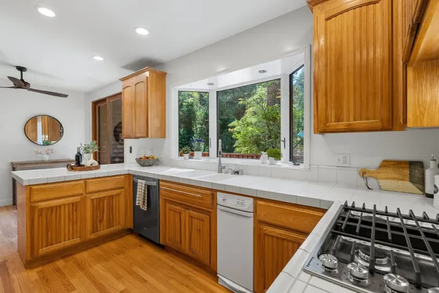 a bed room with a bed and a wooden floor