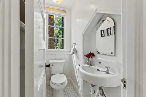 a spacious bedroom with a large bed and a large window