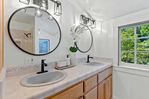 a spacious bedroom with a large bed and a window