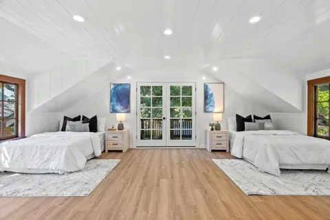 a view of balcony with wooden floor and outdoor seating