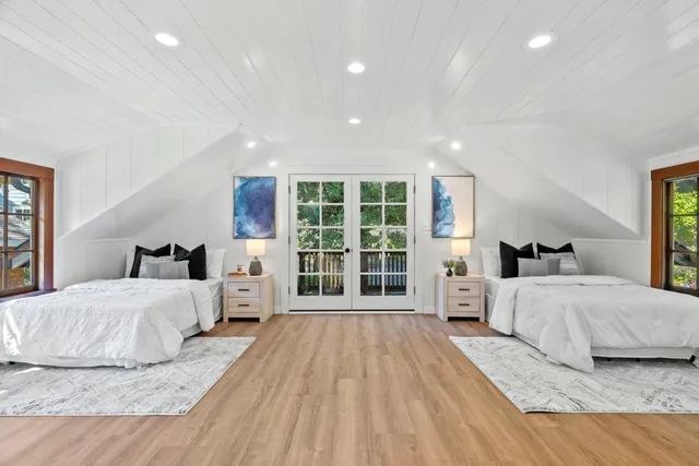 a view of balcony with wooden floor and outdoor seating