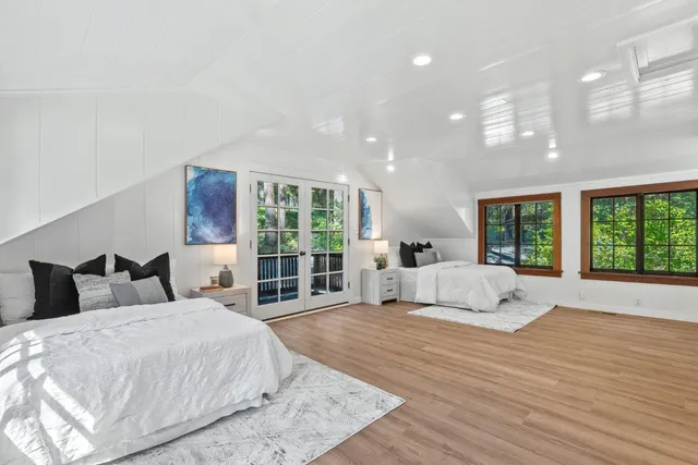 a porch with seating space and yard in the back