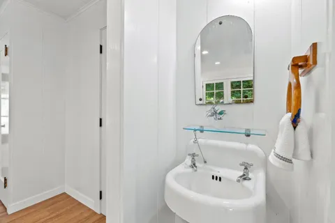 a house view with a sitting space and garden