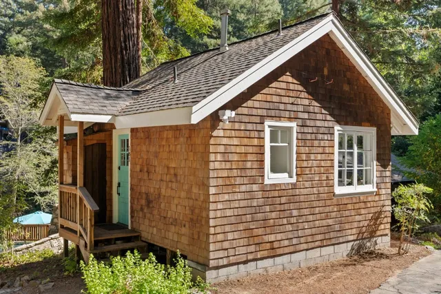 an outdoor space with furniture and umbrella