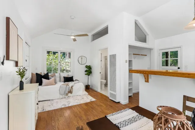a view of a lake with table and chairs