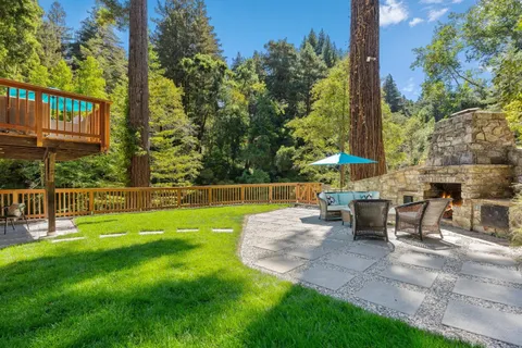 a view of a house with a porch and furniture
