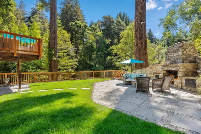 a view of a house with a porch and furniture