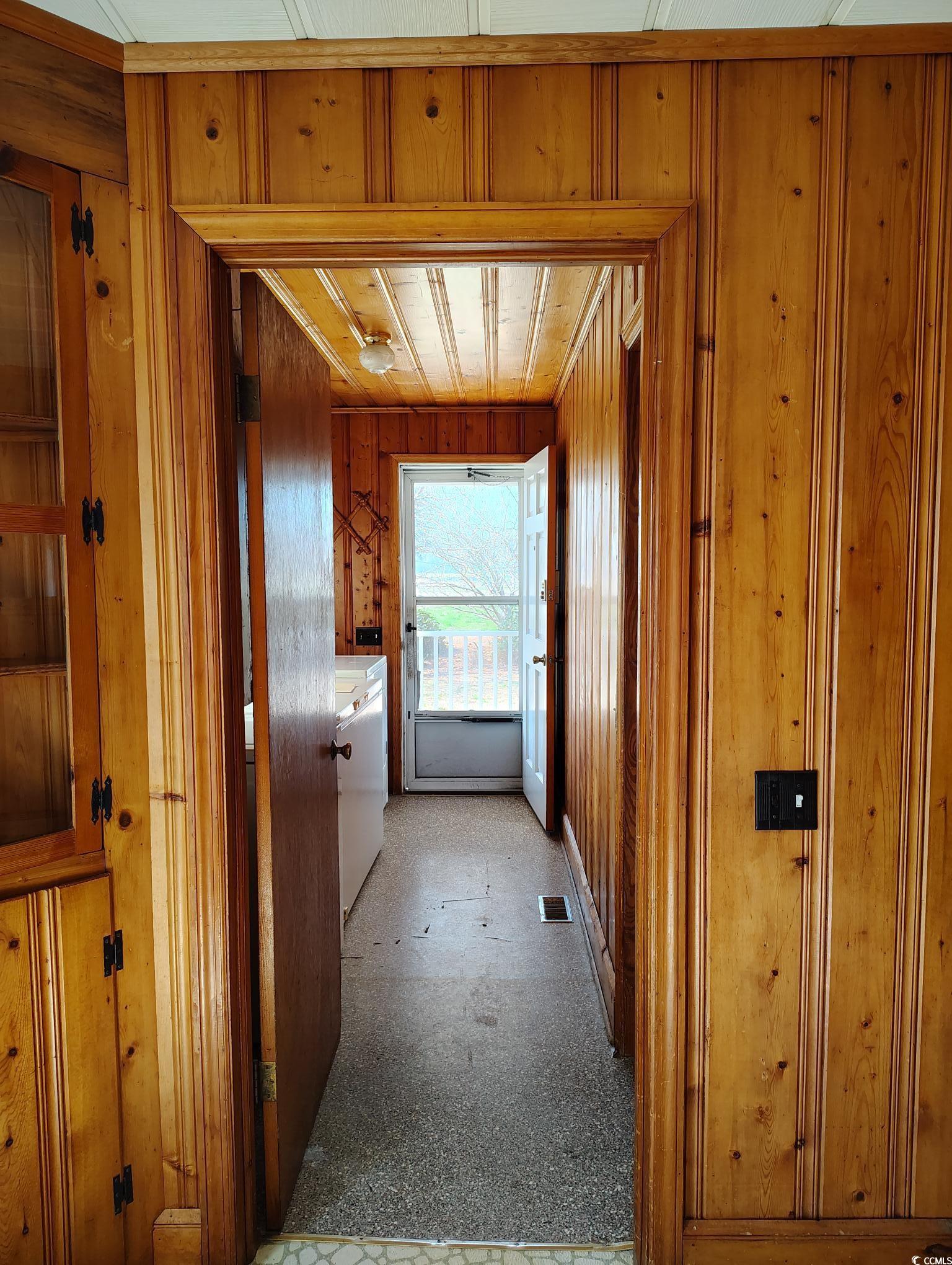 1375 Kenny Jordan Road Tabor City, NC 28463 - Photo 14 of 15 Hallway with visible vents and wood walls