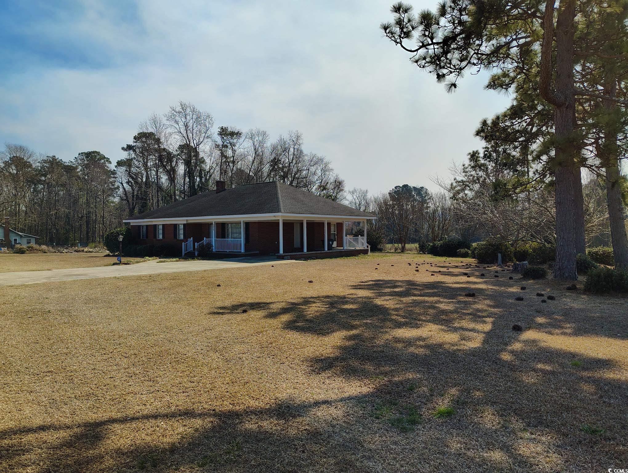 1375 Kenny Jordan Road Tabor City, NC 28463 - Photo 3 of 15 View of front of house with a porch and a front yard