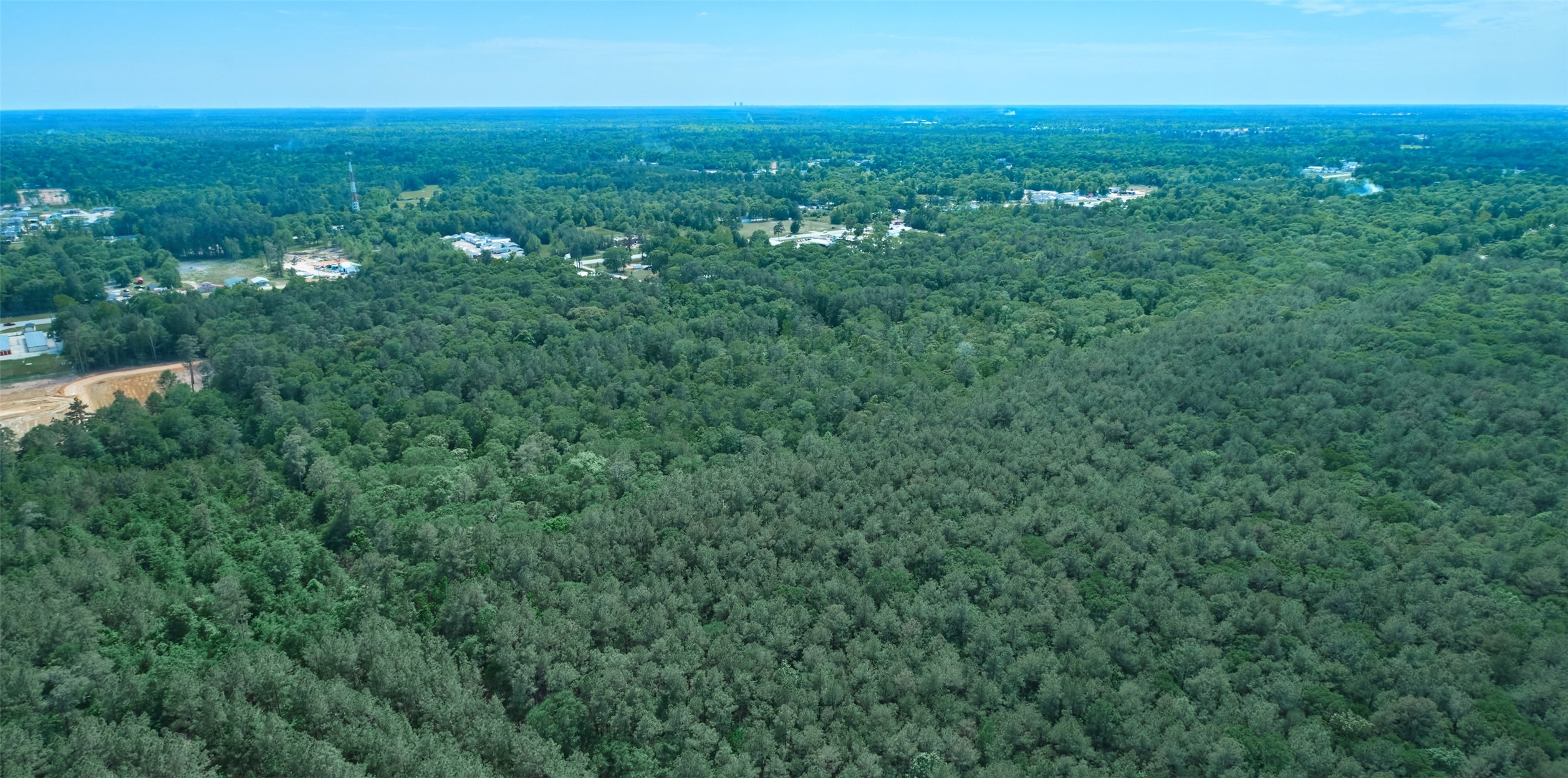 105e At Crowson Rdg Road Conroe, TX 77306 - Photo 12 of 15 Unrestricted 34+ acres for Residential or Commercial Development. Back left aerial view hilites limiless opportunities to grow your business or add to your development portfolio. Existing Survey available.