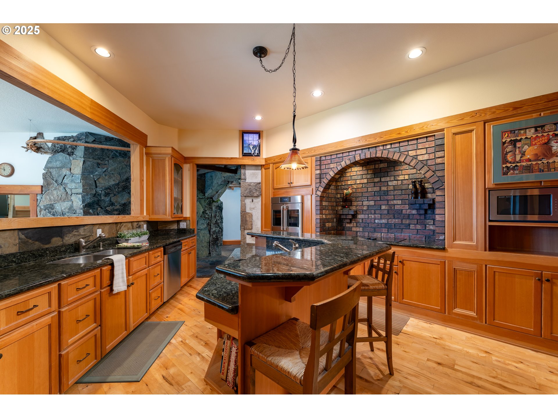 22091 South Ridge Road Oregon City, OR 97045 - Photo 12 of 48 a kitchen with stainless steel appliances granite countertop a stove a sink and a refrigerator