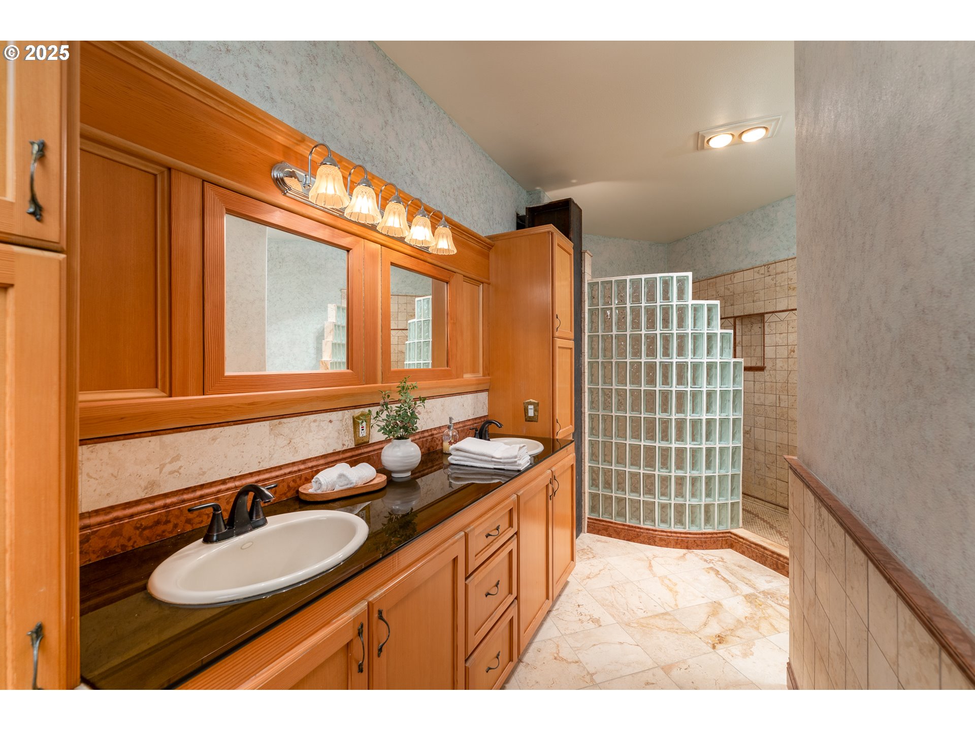 22091 South Ridge Road Oregon City, OR 97045 - Photo 26 of 48 a bathroom with a sink double vanity and a shower