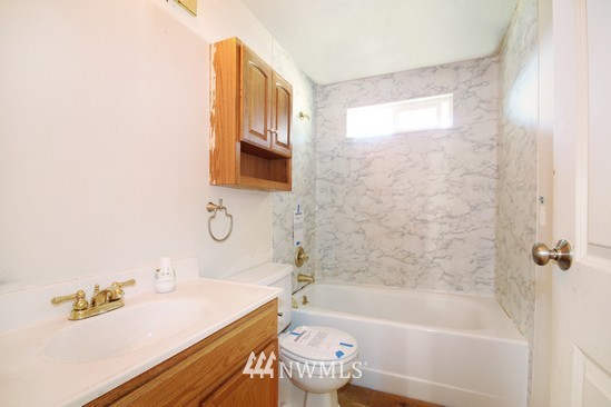 21705 6th Avenue West Bothell, WA 98021 - Photo 11 of 15 a bathroom with a sink a toilet and a bathtub