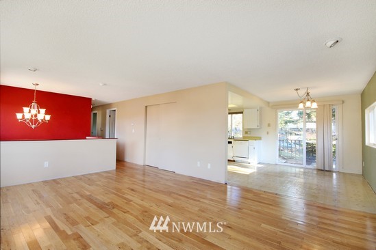 21705 6th Avenue West Bothell, WA 98021 - Photo 6 of 15 a view of empty room with wooden floor