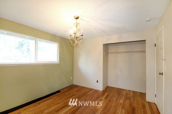 21705 6th Avenue West Bothell, WA 98021 - Photo 9 of 15 a view of a room with wooden floor and a window