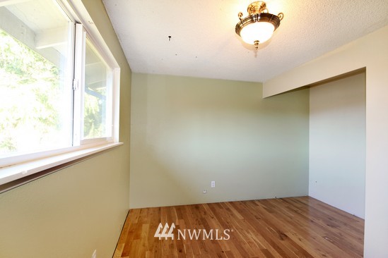 21705 6th Avenue West Bothell, WA 98021 - Photo 10 of 15 a view of a room with a window and a ceiling fan