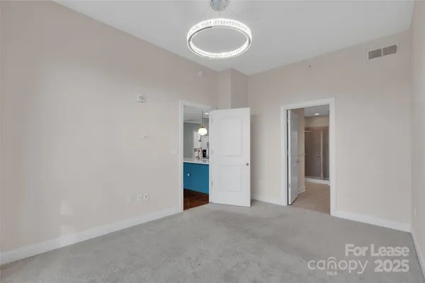 a view of an empty room with a bathroom