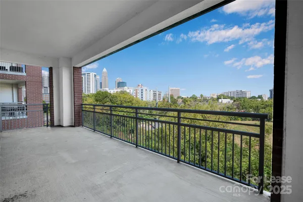 a view of balcony with furniture
