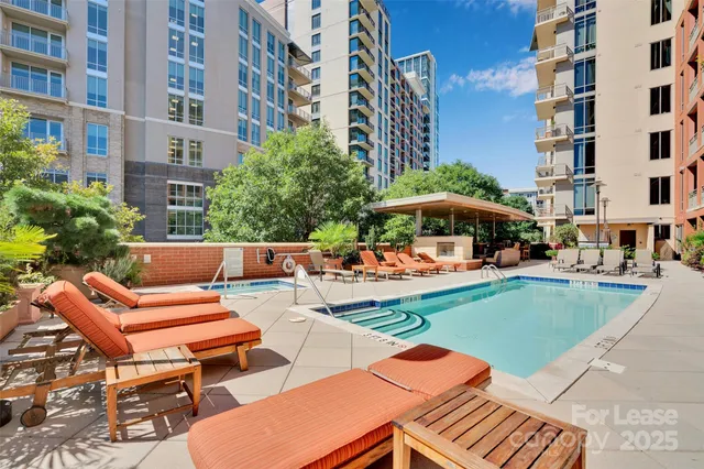 a view of a patio with a table and chairs under an umbrella