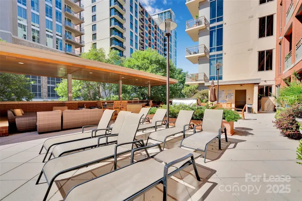 a view of a patio with couches and chairs