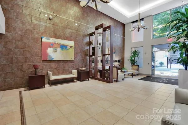 a view of a livingroom with furniture and staircase