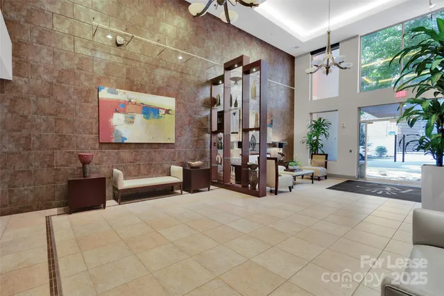 a view of a livingroom with furniture and staircase