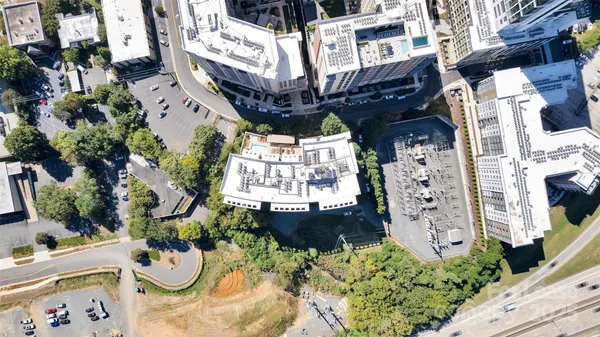 a view of a patio with table and chairs with potted plants