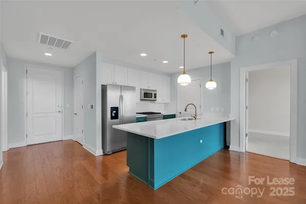 a view of a kitchen counter top space and sink