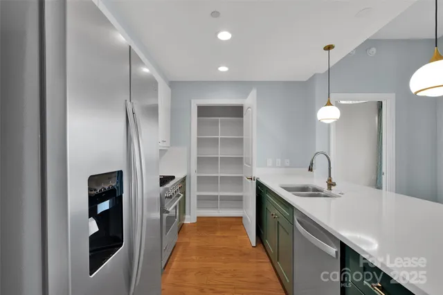 a bathroom with a double vanity sink a and a shower