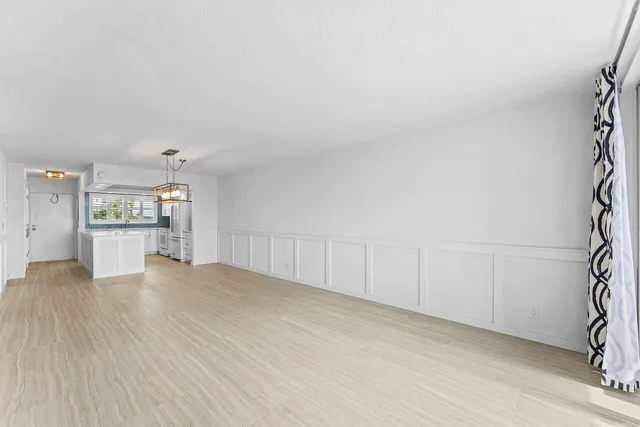 a view of kitchen with sink and wooden floor
