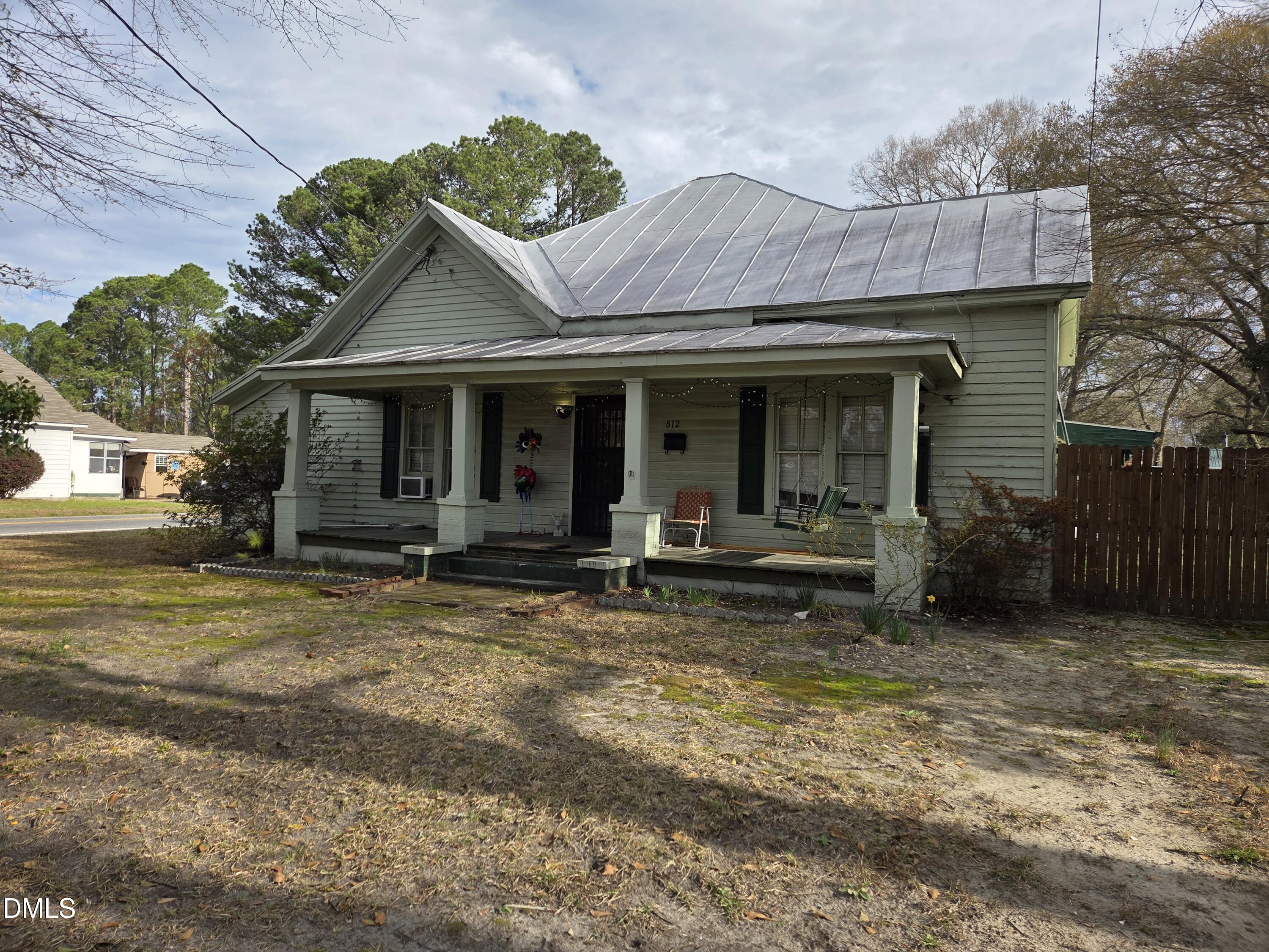 812 West Anderson Street Selma, NC 27576 - Photo 5 of 20 a view of a house with backyard porch and sitting area