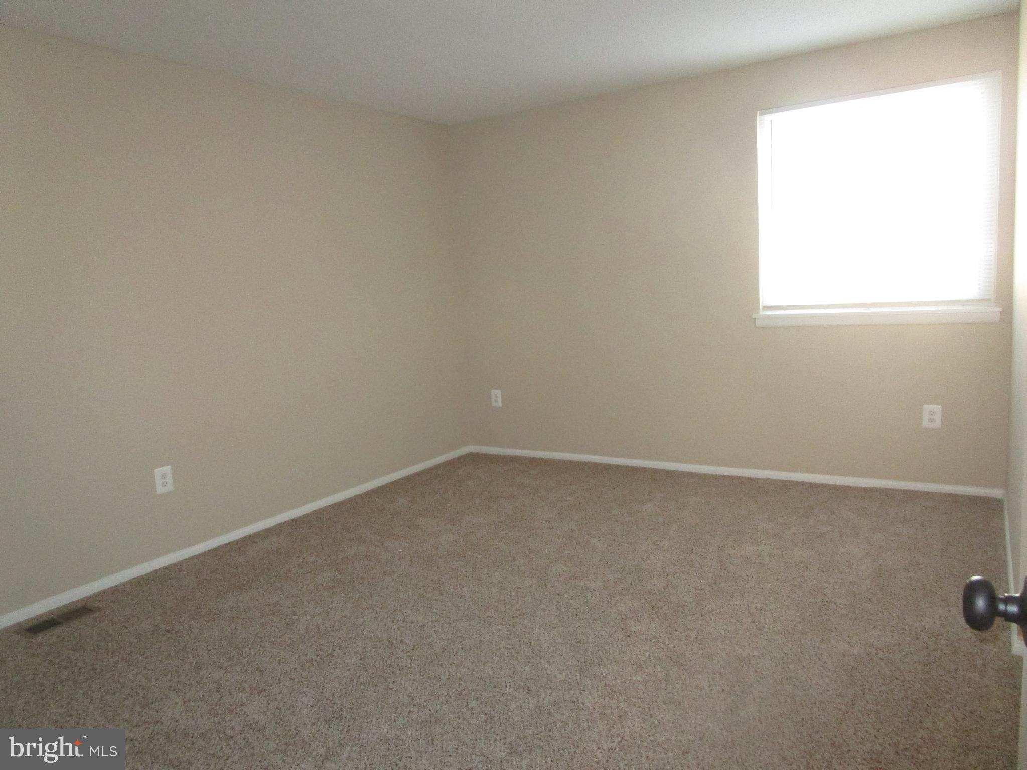 7291 E Coachlight Court Frederick, MD 21703 - Photo 12 of 19 an empty room with a window