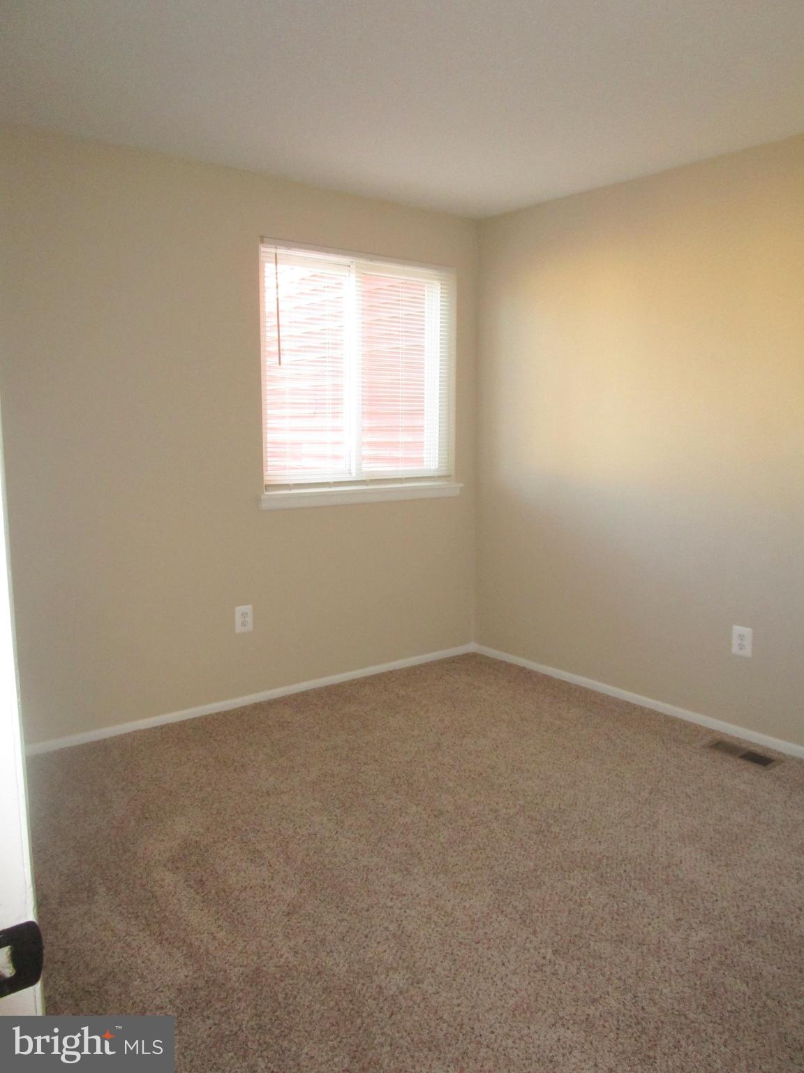 7291 E Coachlight Court Frederick, MD 21703 - Photo 15 of 19 an empty room with a window