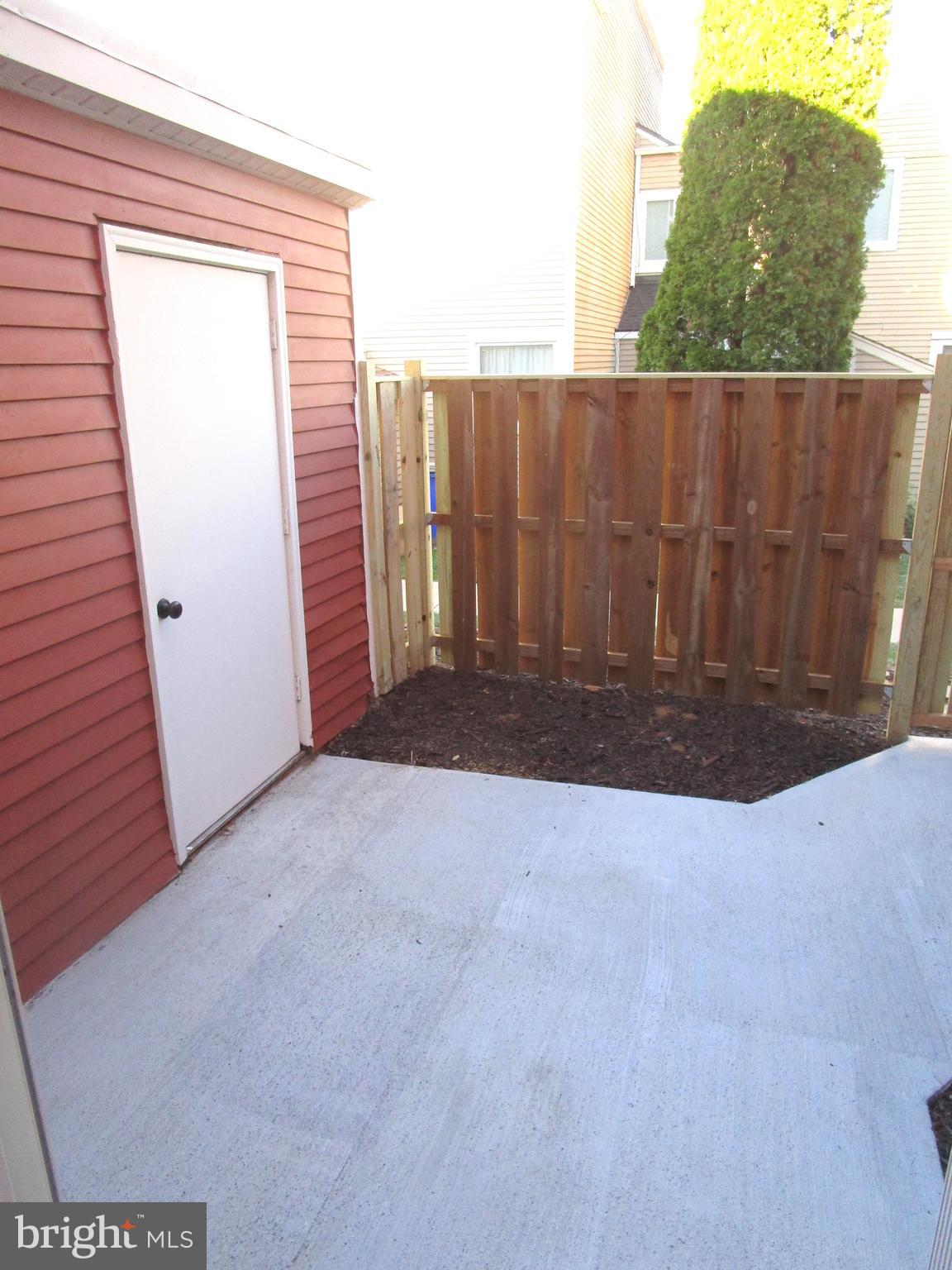7291 E Coachlight Court Frederick, MD 21703 - Photo 18 of 19 a view of backyard with wooden fence