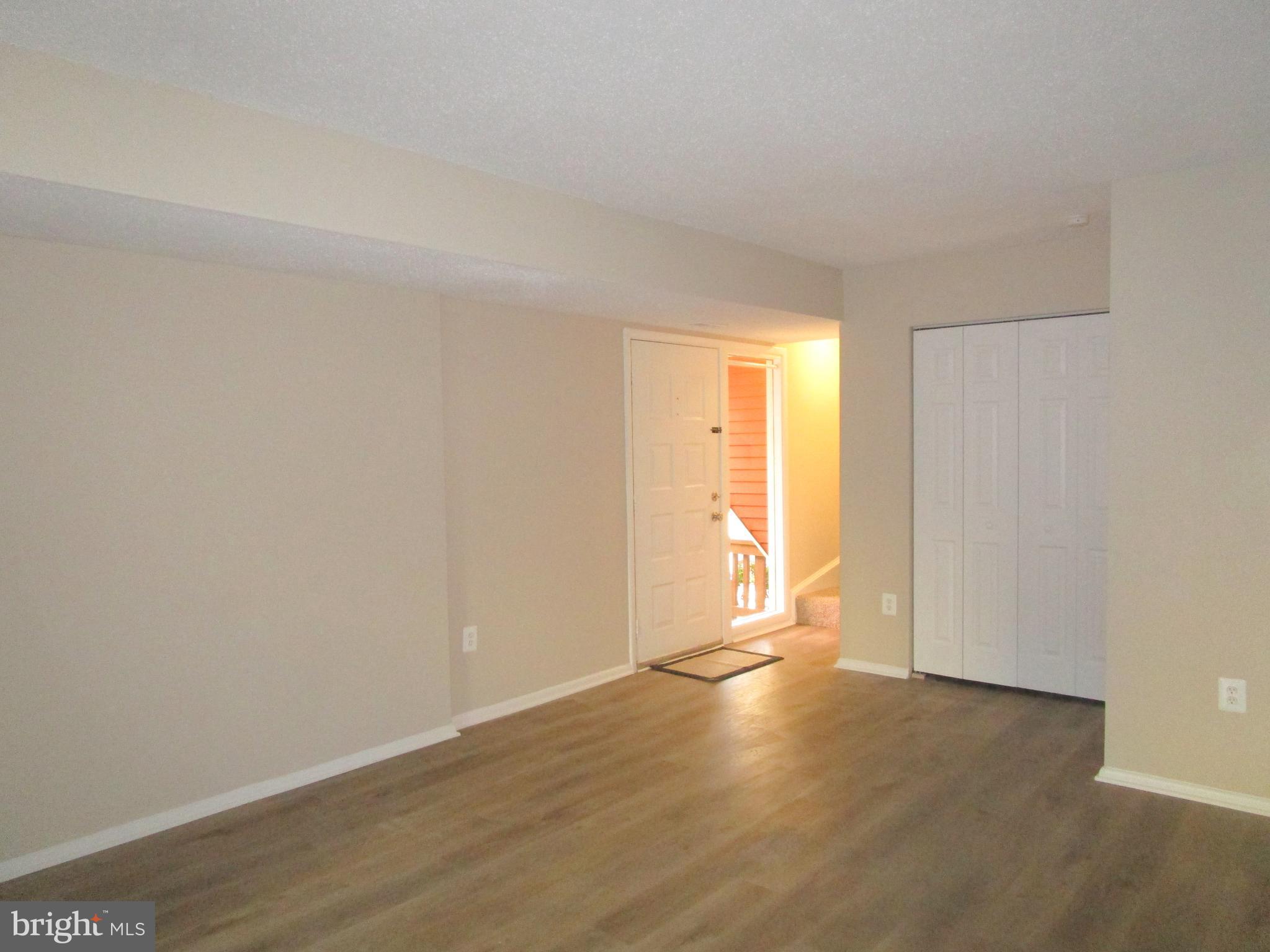 7291 E Coachlight Court Frederick, MD 21703 - Photo 2 of 19 a view of an empty room and wooden floor