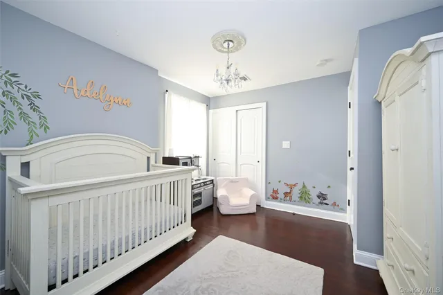 a view of a bedroom with wooden furniture