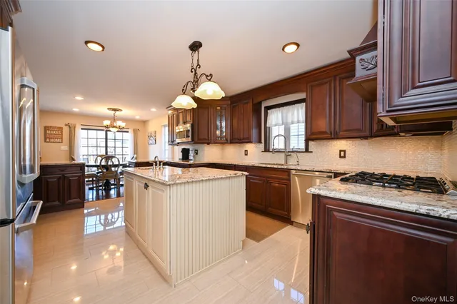 a kitchen with a stove cabinets and a refrigerator