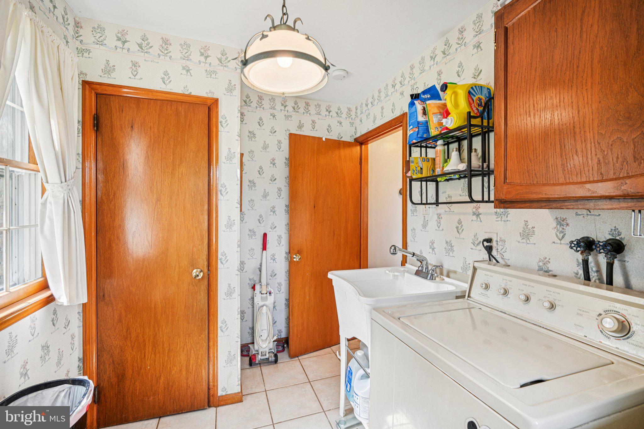 25618 Mt Pleasant Road Columbus, NJ 08022 - Photo 34 of 61 a bathroom with a sink a mirror and a shower curtain