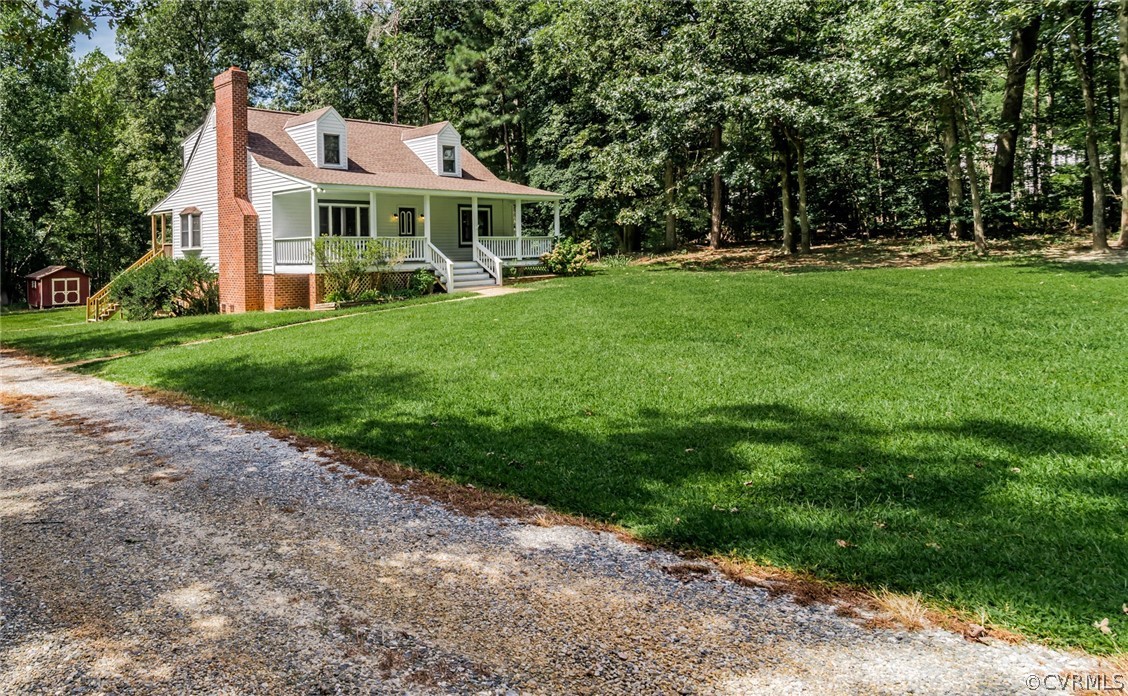 4900 North Courthouse Road Providence Forge, VA 23140 - Photo 2 of 50 a front view of a house with a yard and trees