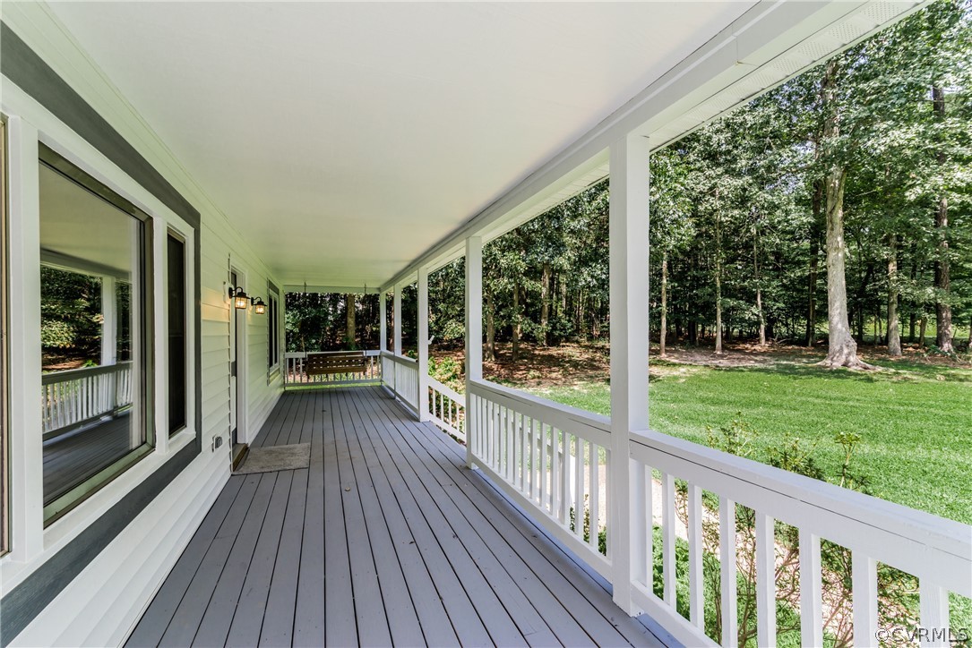 4900 North Courthouse Road Providence Forge, VA 23140 - Photo 7 of 50 a view of a house with porch and wooden floor