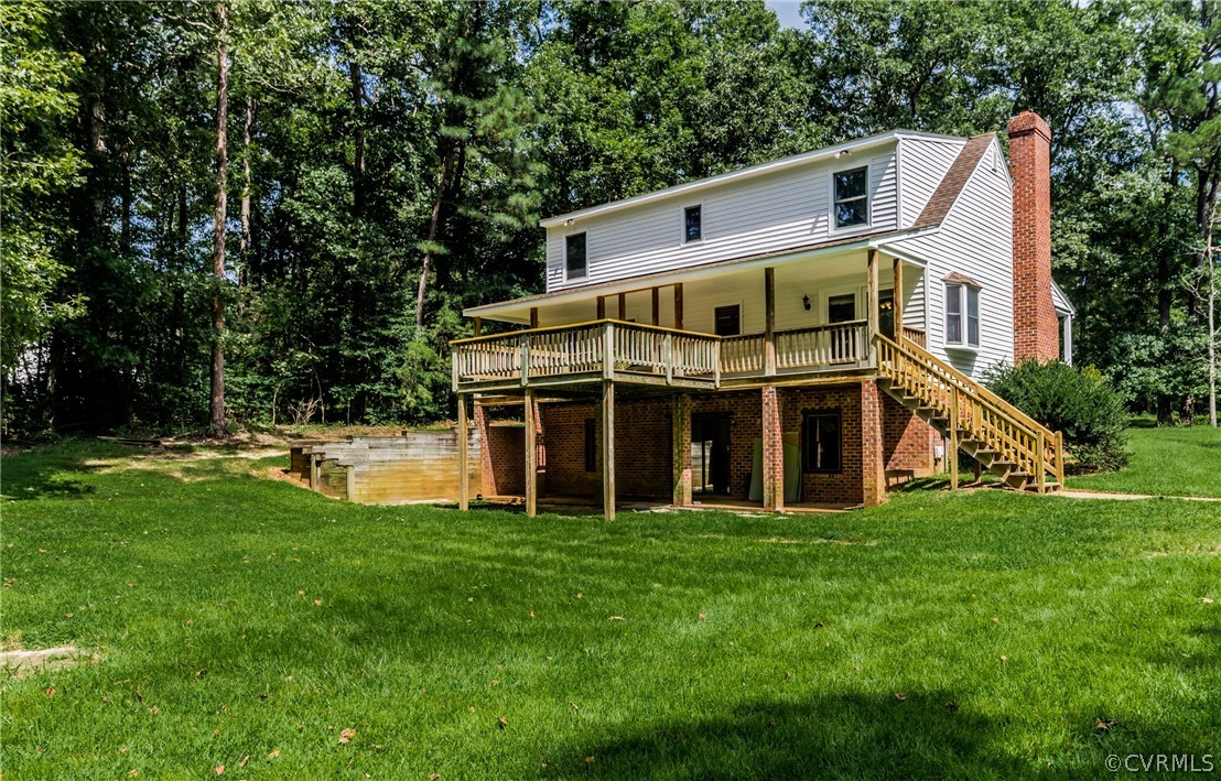 4900 North Courthouse Road Providence Forge, VA 23140 - Photo 10 of 50 a view of a house with a big yard and large trees