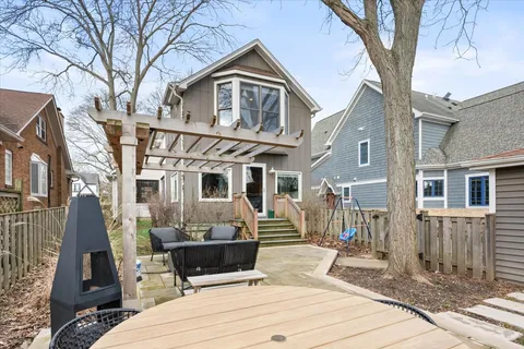 front view of a house with a bench