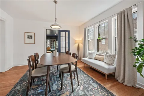 a dining room with furniture and window