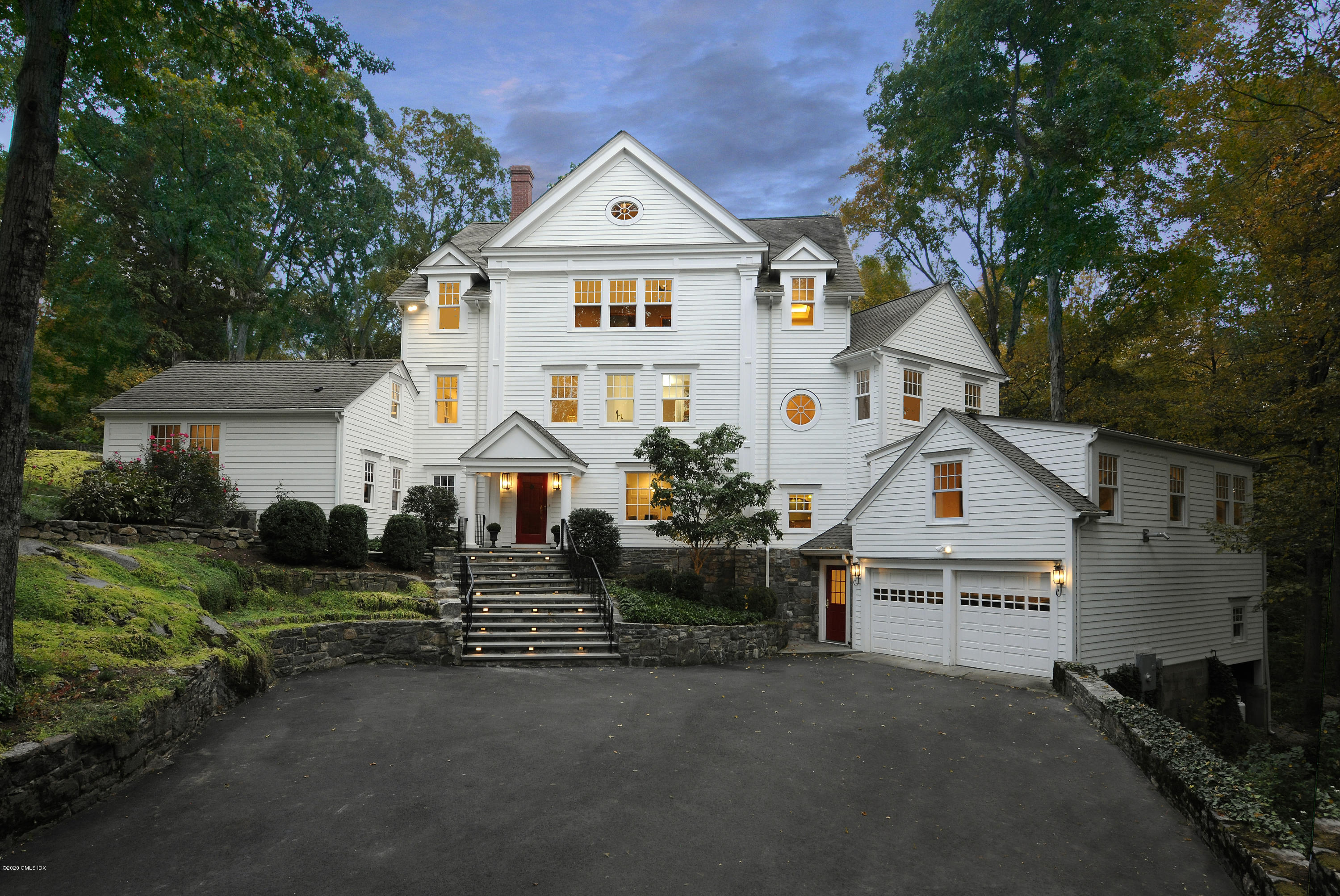 a view of house with outdoor space and parking