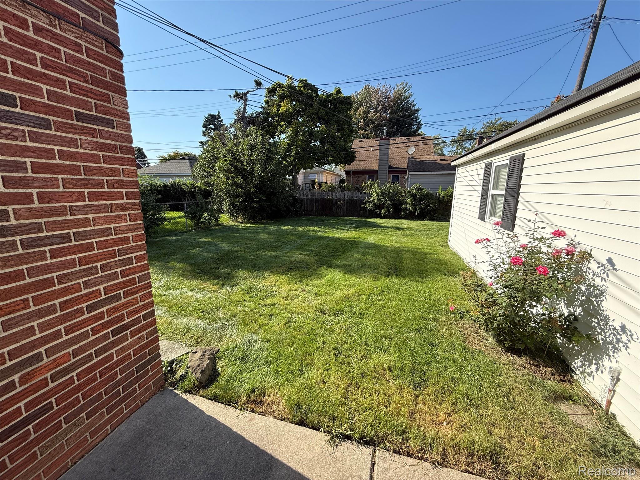 3500 Southfield Road Dearborn, MI 48124 - Photo 14 of 15 Expansive lawn area with mature perimeter foliage and paved walkways