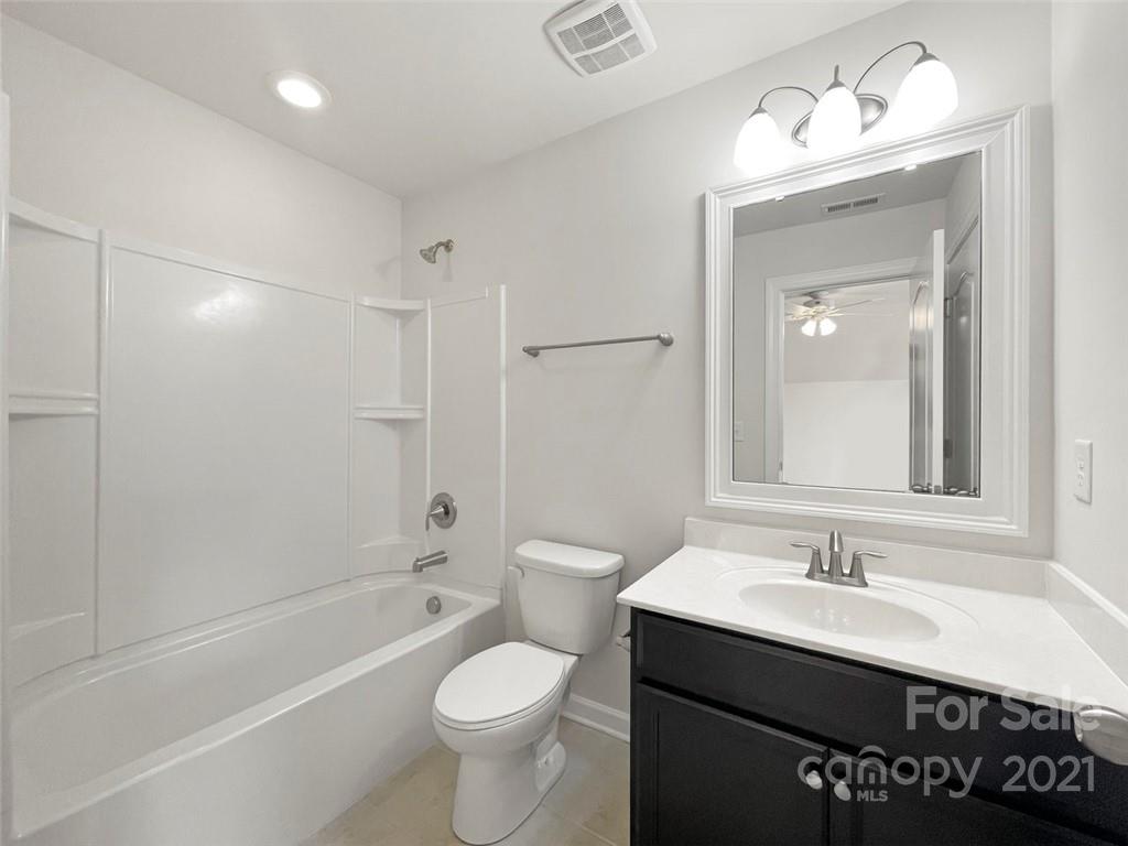 4331 Oxford Mill Road Waxhaw, NC 28173 - Photo 42 of 48 a bathroom with a sink a toilet and shower