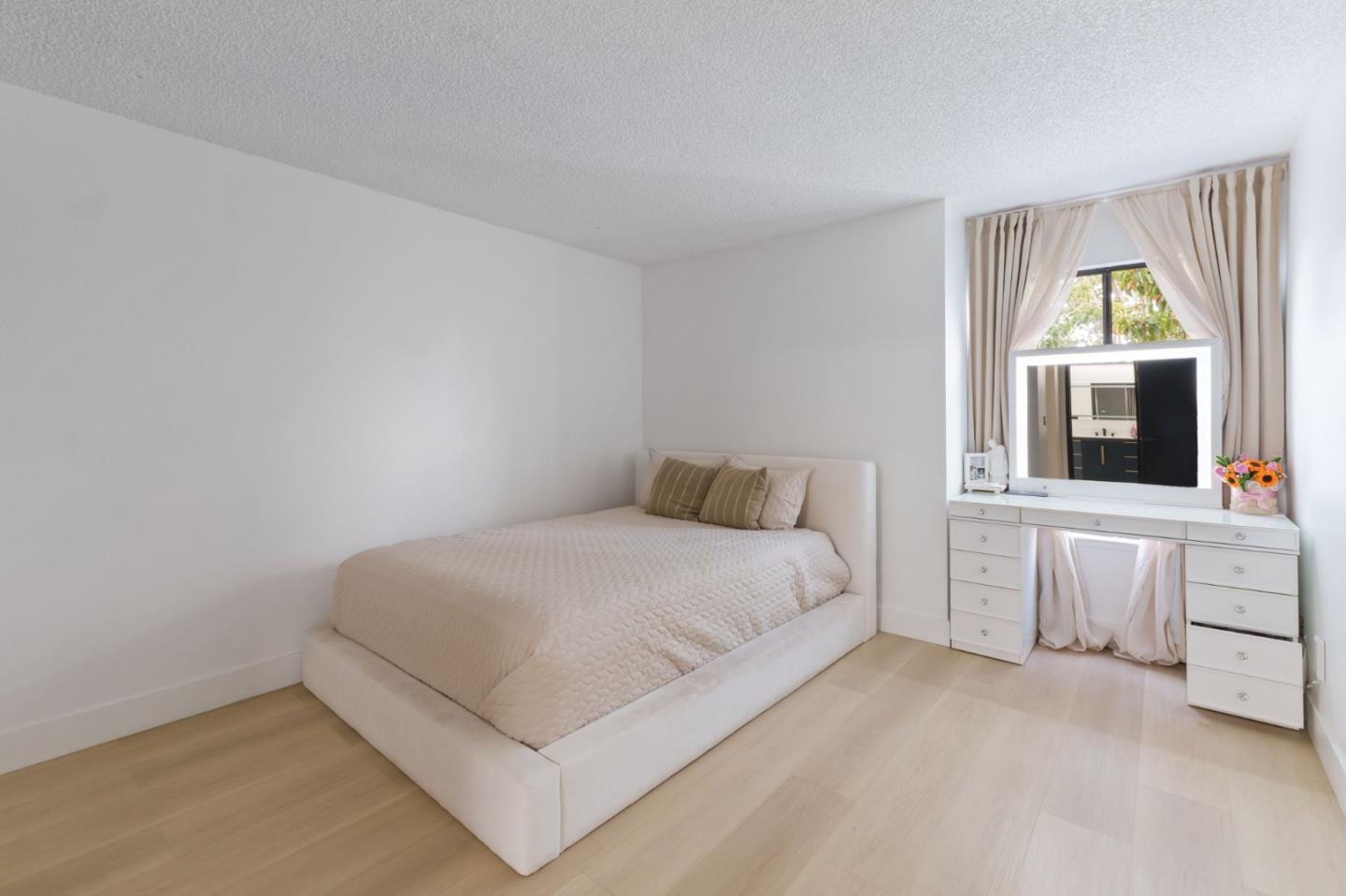 2422 North Main Street, Unit F Salinas, CA 93906 - Photo 18 of 22 a bedroom with a bed and a large window