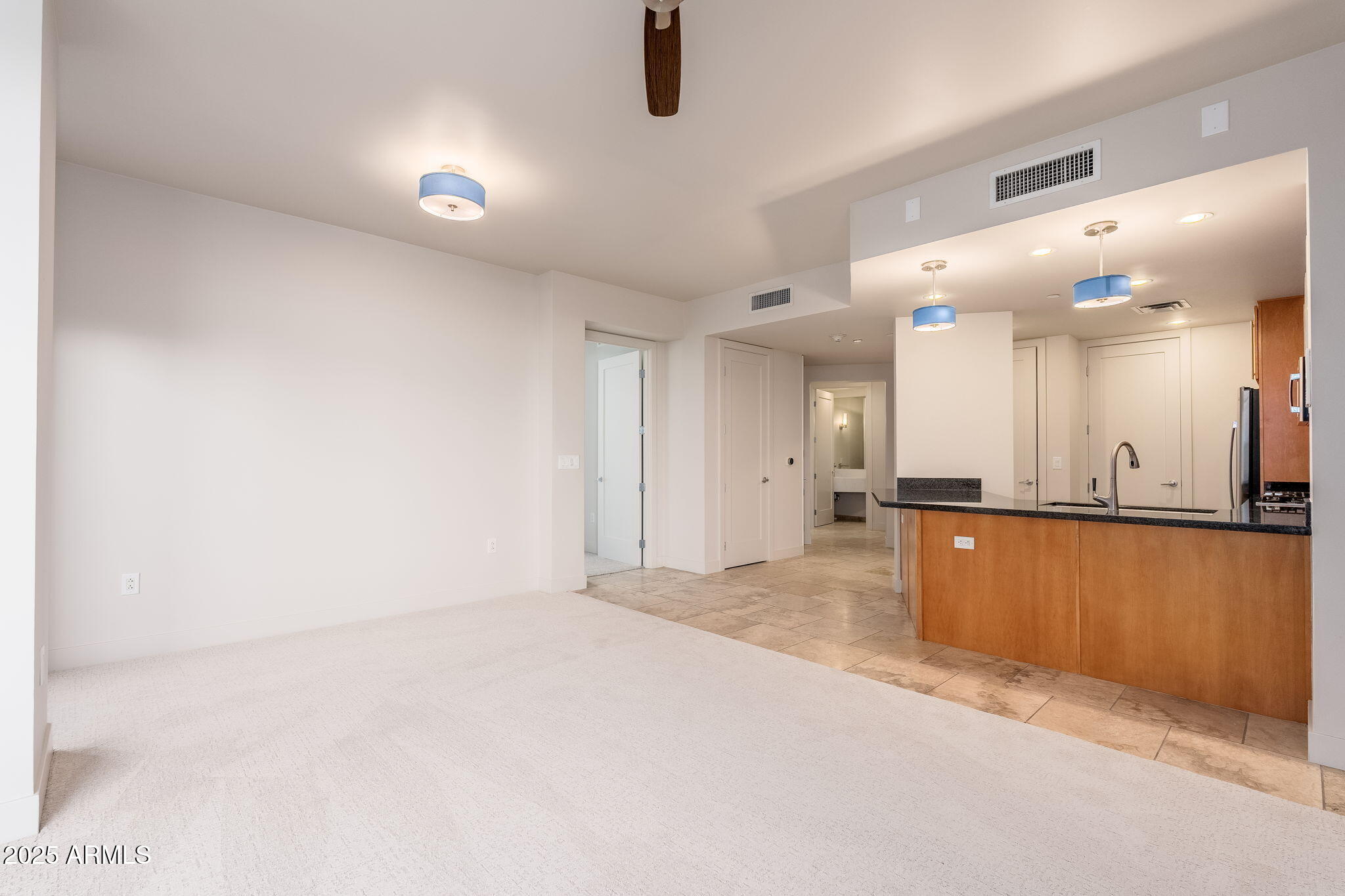 120 East Rio Salado Parkway, Unit 301 Tempe, AZ 85281 - Photo 9 of 42 Living room back to Kitchen & entry