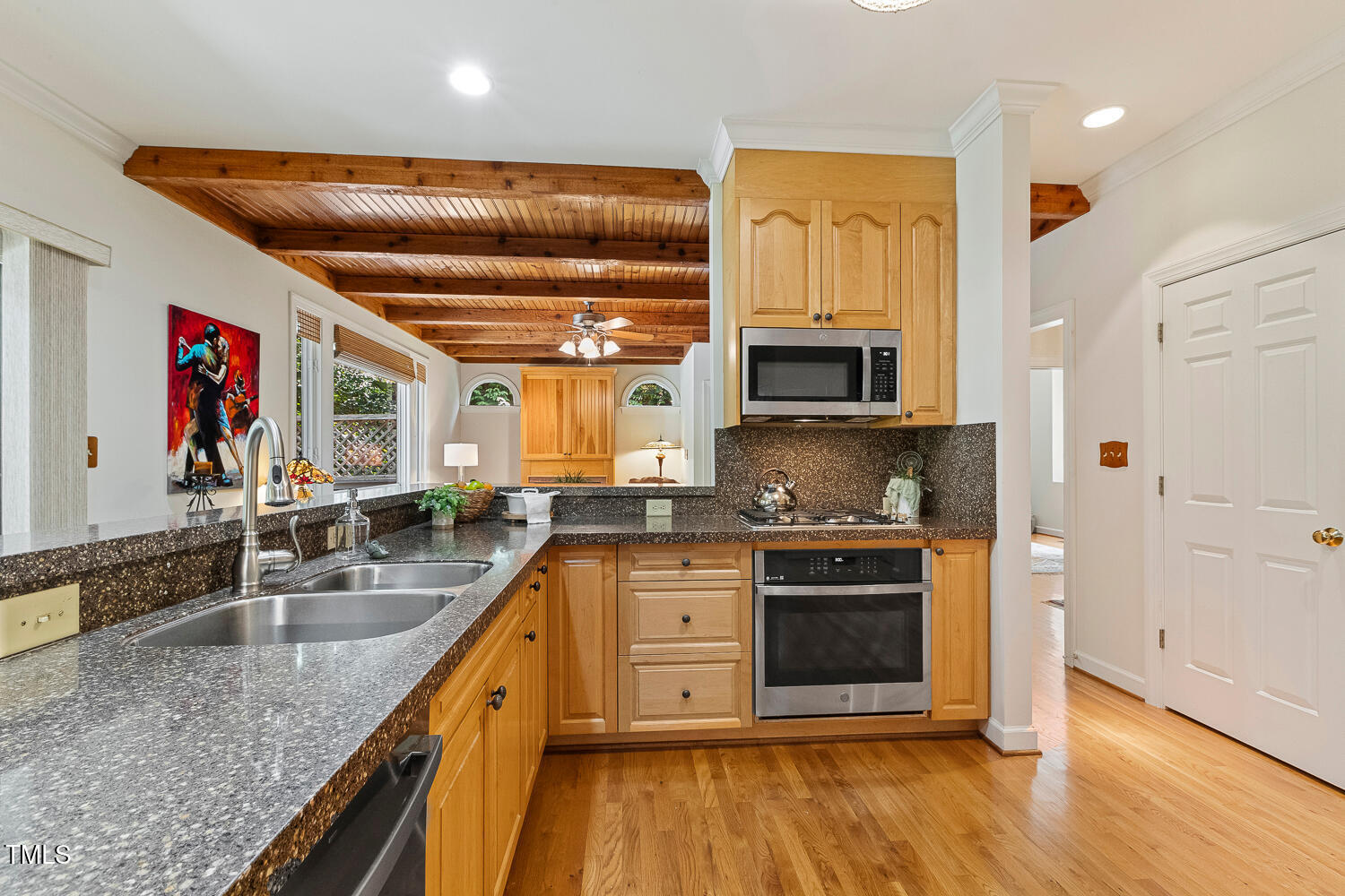 101 Cardiff Place Chapel Hill, NC 27516 - Photo 20 of 82 a kitchen with stainless steel appliances granite countertop a stove a sink and a microwave