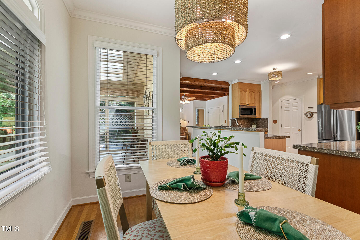 101 Cardiff Place Chapel Hill, NC 27516 - Photo 25 of 82 a view of a dining room with furniture a potted plant and a fireplace